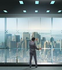 Fototapeta premium Businessman in front of office window thinking of new challenges