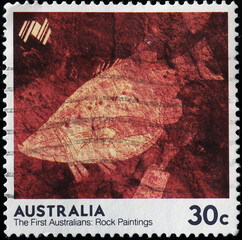 Aboriginal rock painting of a fish on australian stamp