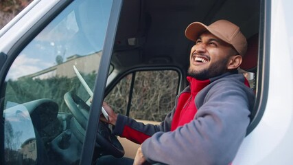 Happy indian courier using tablet in the van . High quality 4k footage
