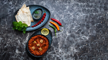 Mhammara is a hot pepper dip originally from Aleppo, Syria , Lebanon found in Levantine and Turkish cuisines.