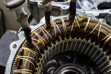 Stator of an IPM-SynRM (Internal Permanent Magnet Synchronous Reluctance Motor) motor of an moder electric vehicle. EV maintenance, service; repair concept; - obrazy, fototapety, plakaty