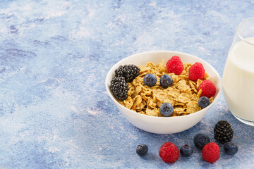 Breakfast bowl with Cereals and fresh berries on blue background 