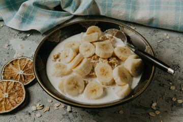 Healthy breakfast - milk with muesli and banana - health and diet concept