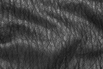 Artificial black leather (synthetic leather) texture detail.