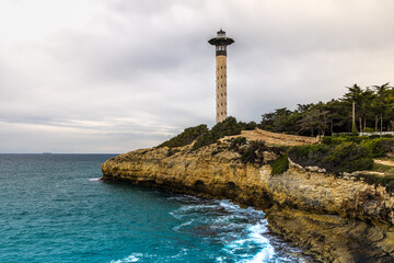 Torredembarra lighthouse next to the Mediterranean Sea