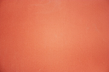 Close-up of painted surface. Bright color of a natural painted wall of the house. Fragment of a freshly painted wall. 