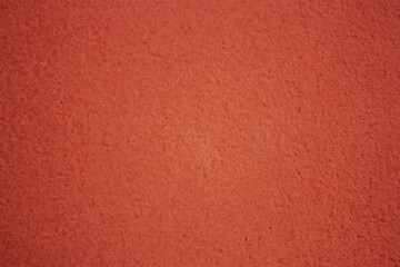 Close-up of painted surface. Bright color of a natural painted wall of the house. Fragment of a freshly painted wall. 