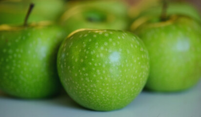 Green apples close up on white background