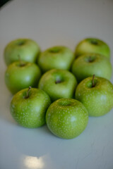 Green apples close up on white background
