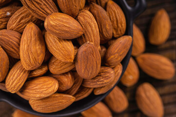 Peeled almonds closeup. For vegetarians. Food background.
