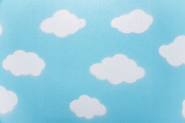 Children's wall painted with blue sky and clouds. Background