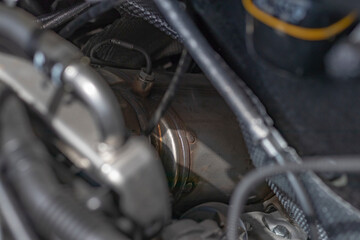Natural light. the car. Engine compartment. Low depth of field. Silencer with a sensor for clogging...
