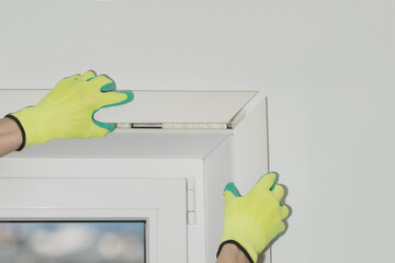 The master makes plastic slopes for windows