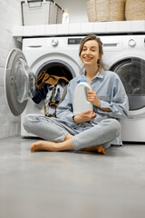 Woman in the laundry room at home