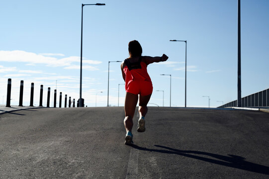 Runner Woman Running From Behind