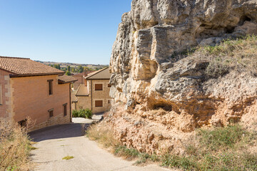 a street close to a rocky hill in Penaranda de Duero, province of Burgos, Castile and Leon, Spain