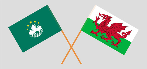 Crossed flags of Macau and Wales. Official colors. Correct proportion