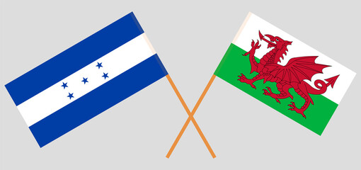 Crossed flags of Honduras and Wales. Official colors. Correct proportion