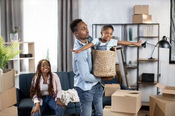 African family playing during enjoying relocation day
