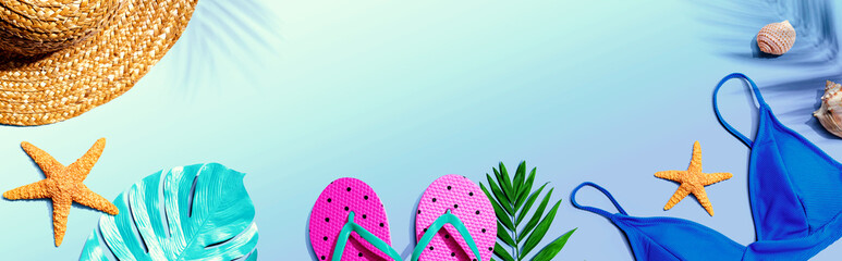 Summer concept with straw hat and swimwear