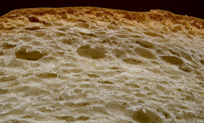 A macro shot of a piece of bread, with rich textures
