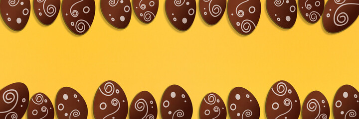 Painted easter eggs on yellow background. Colorful. Paper texture. Illustration. Banner.