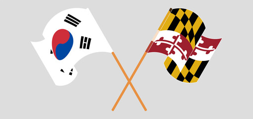 Crossed and waving flags of South Korea and the State of Maryland