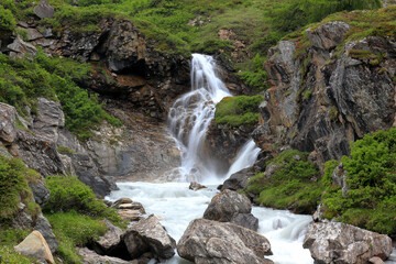 Waterfall in the Alps mountains	
