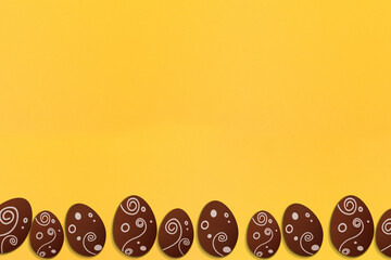 Painted easter eggs on yellow background. Colorful. Paper texture. Illustration.