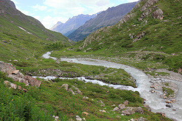 Fototapeta na wymiar Stream in the Alps mountains 