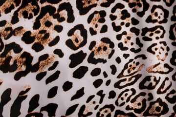 Leopard fur background. Leopard skin texture. Leopard print. Background with a pattern of leopard...