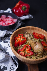 Typical dish of Peru Rice with chicken, in dark food tones and as a complement beet salad.