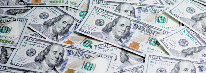 Pile of one hundred dollar bills new design