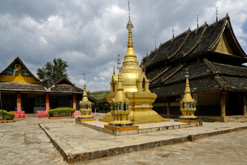 Fototapeta premium Buddhist temple, stupa, and monastery, Jingzhen, Xishuangbanna, Yunnan, China