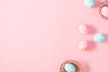 Easter pink composition. Easter eggs on pastel pink background. Minimal concept of Easter. Flat lay, top view, copy space. 