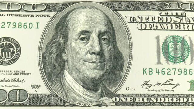 One hundred dollars. Benjamin Franklin is happy. An animated face of Benjamin Franklin on a hundred dollar bill. Two luma matte channels.