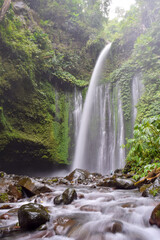 Refreshing view of Tiu Kelep waterfall located at the feet of Mount Rinjani, Lombok, Indonesia.