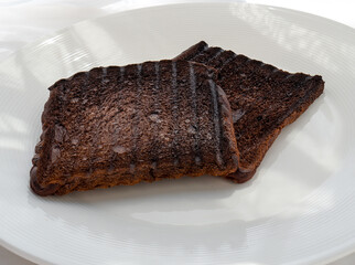 Toasted sliced ​​black bread or brown bread. Chocolate bread. Slices of burnt bread.