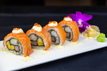 Salmon Sushi Served with pickled ginger Decorated with orchids