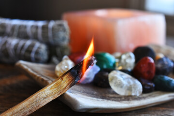 A close up image of a burning incense stick and healing crystals.  - obrazy, fototapety, plakaty