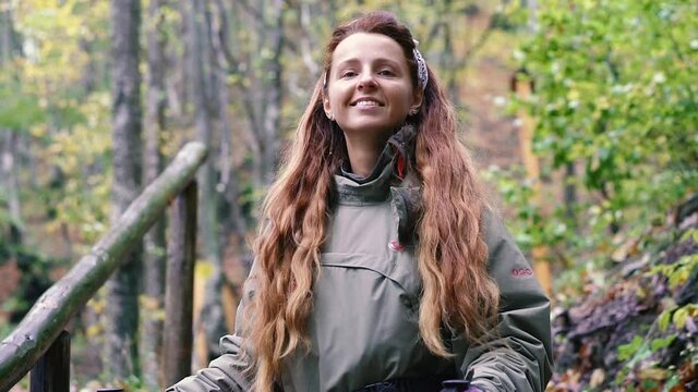 Hiking. Woman tourist walks pawns along the mountain slopes. Carpathians. Ukraine.