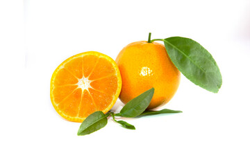 Citrus fruit with leaves with half orange slices isolated on white background
