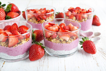 Dessert with chia pudding, granola and strawberries