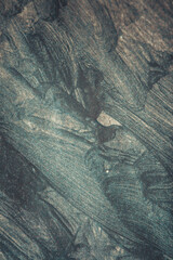 Strokes or smears of black paint close-up