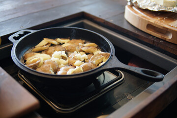 fried potatoes roasting in frying pan