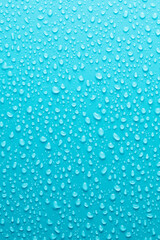 Naklejka na ściany i meble Water drops on blue