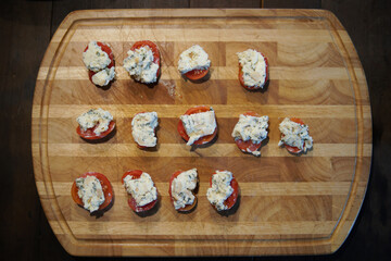 tomatoes with farmer paneer cottage cheese. vegetarian meal appetizer.