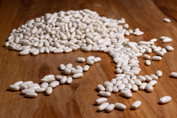 white dry beans on a wooden table