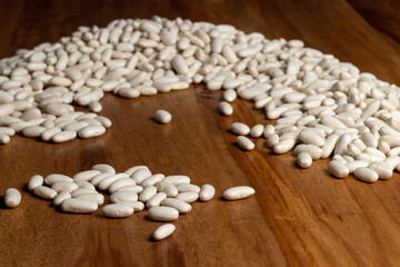 white dry beans on a wooden table