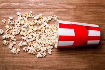 Heap of delicious popcorn isolated on wooden background. popcorn close-up